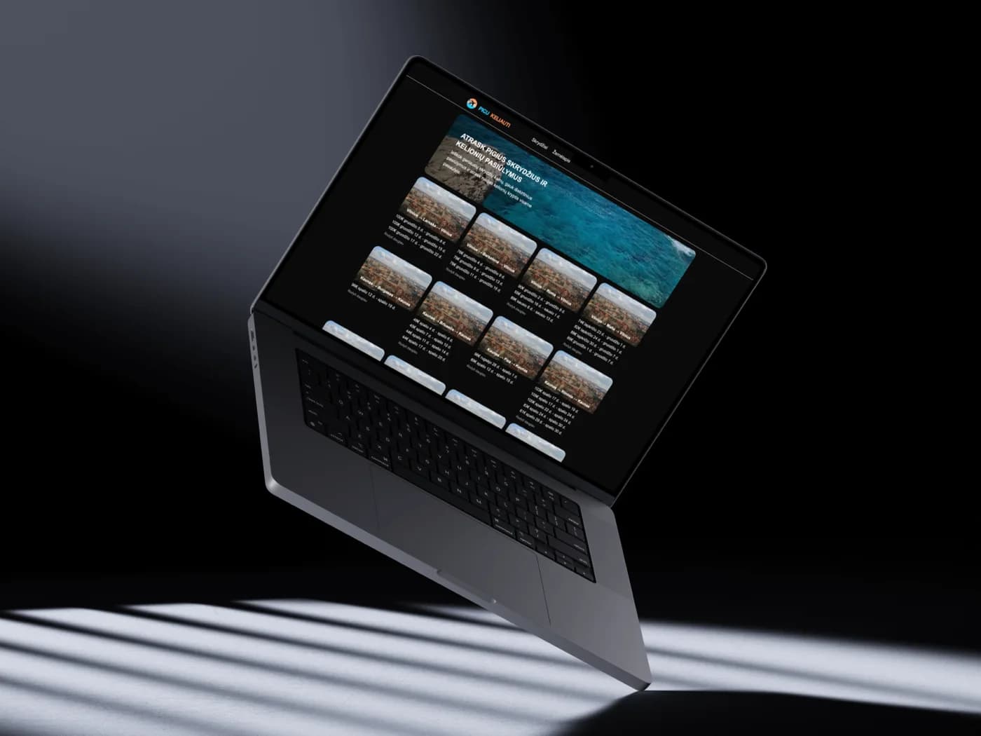 Laptop showing a dark-themed travel search website with a grid of deals